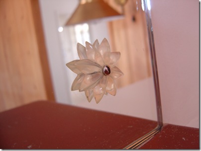 dated fixture on a mirror